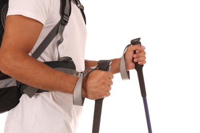 Photo of Man with backpack and trekking poles on white background, closeup