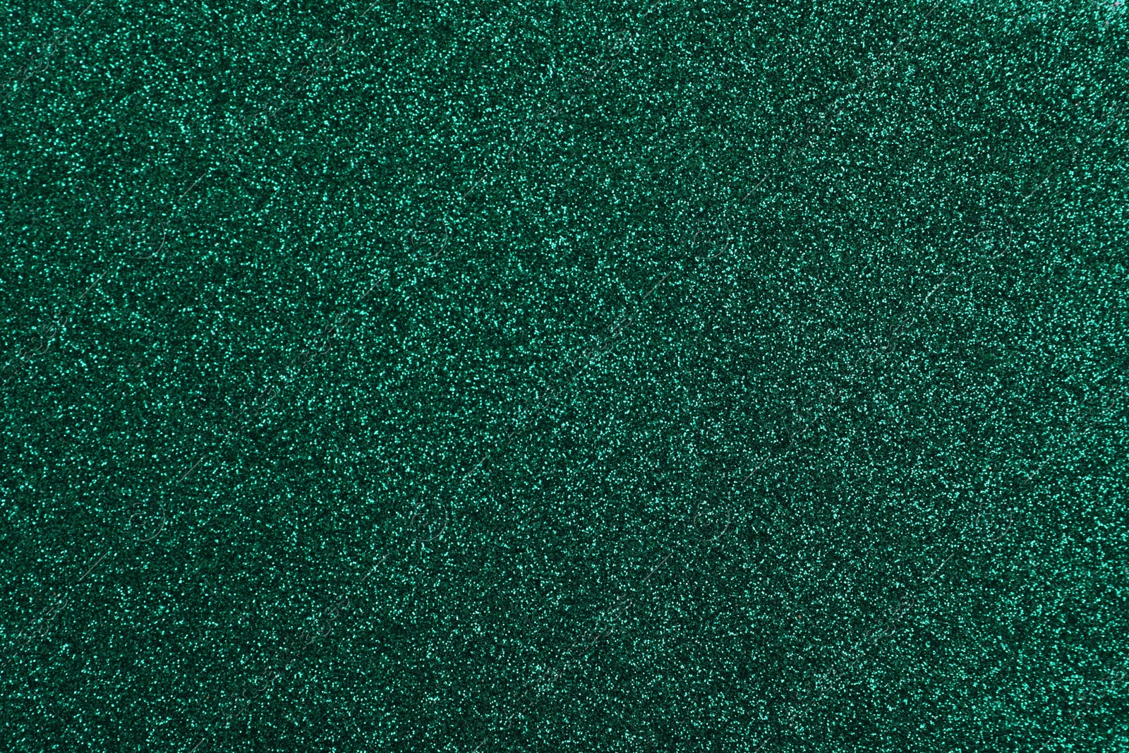 Photo of Shiny dark green glitter as background, closeup