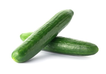 Photo of Fresh green cucumbers on white background