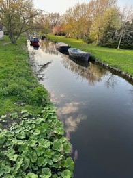 Beautiful view of canal with moored boats in city