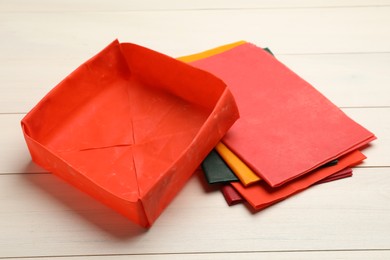 Photo of Color reusable beeswax food wraps on white wooden table