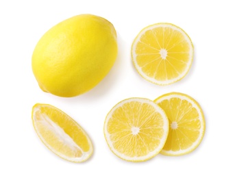 Photo of Sliced and whole fresh lemons on white background, top view