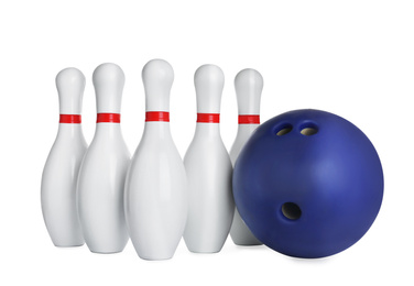 Photo of Blue bowling ball and pins isolated on white