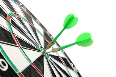 Photo of Dart board with color arrows hitting target, closeup