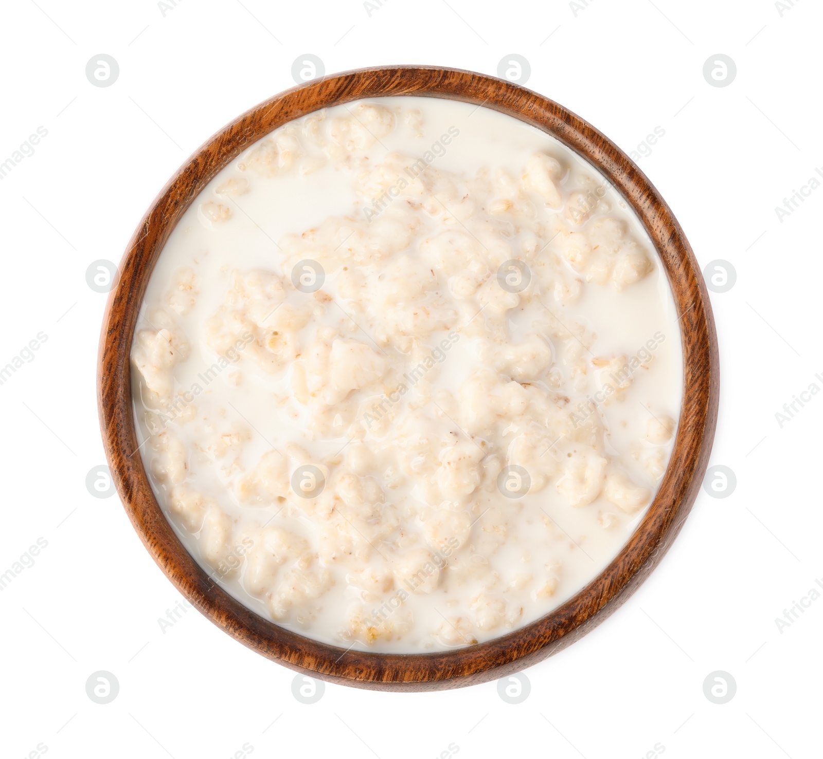 Photo of Tasty boiled oatmeal in bowl isolated on white, top view