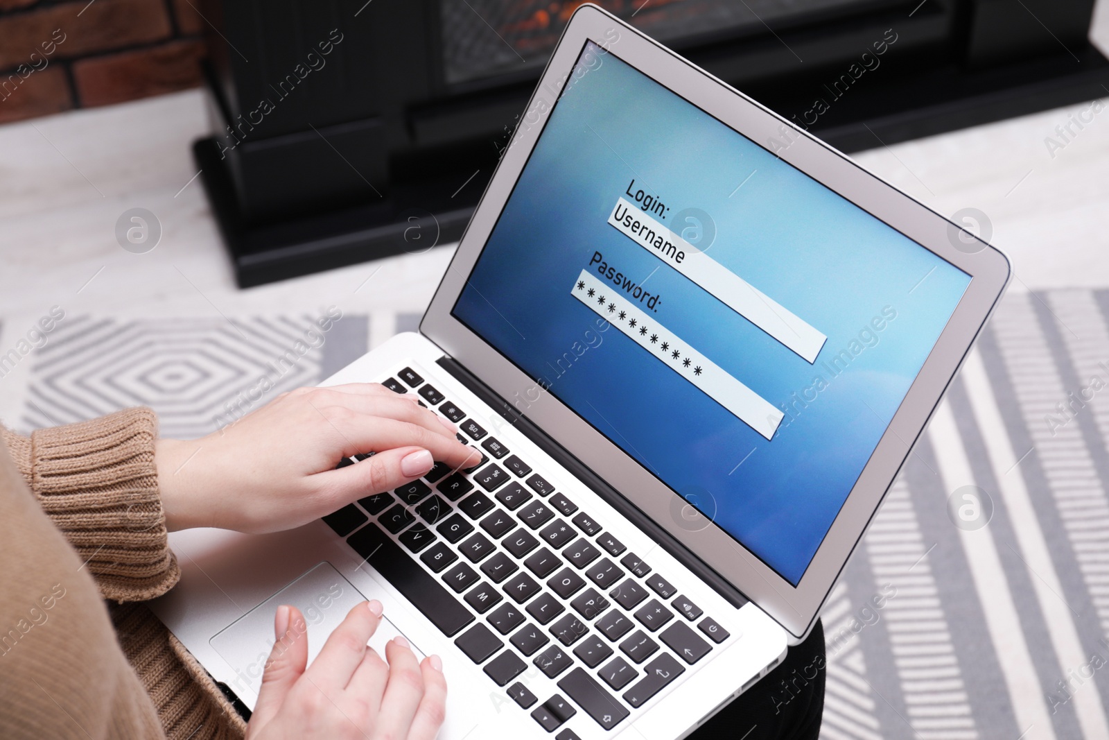 Photo of Woman unlocking laptop with blocked screen indoors, closeup