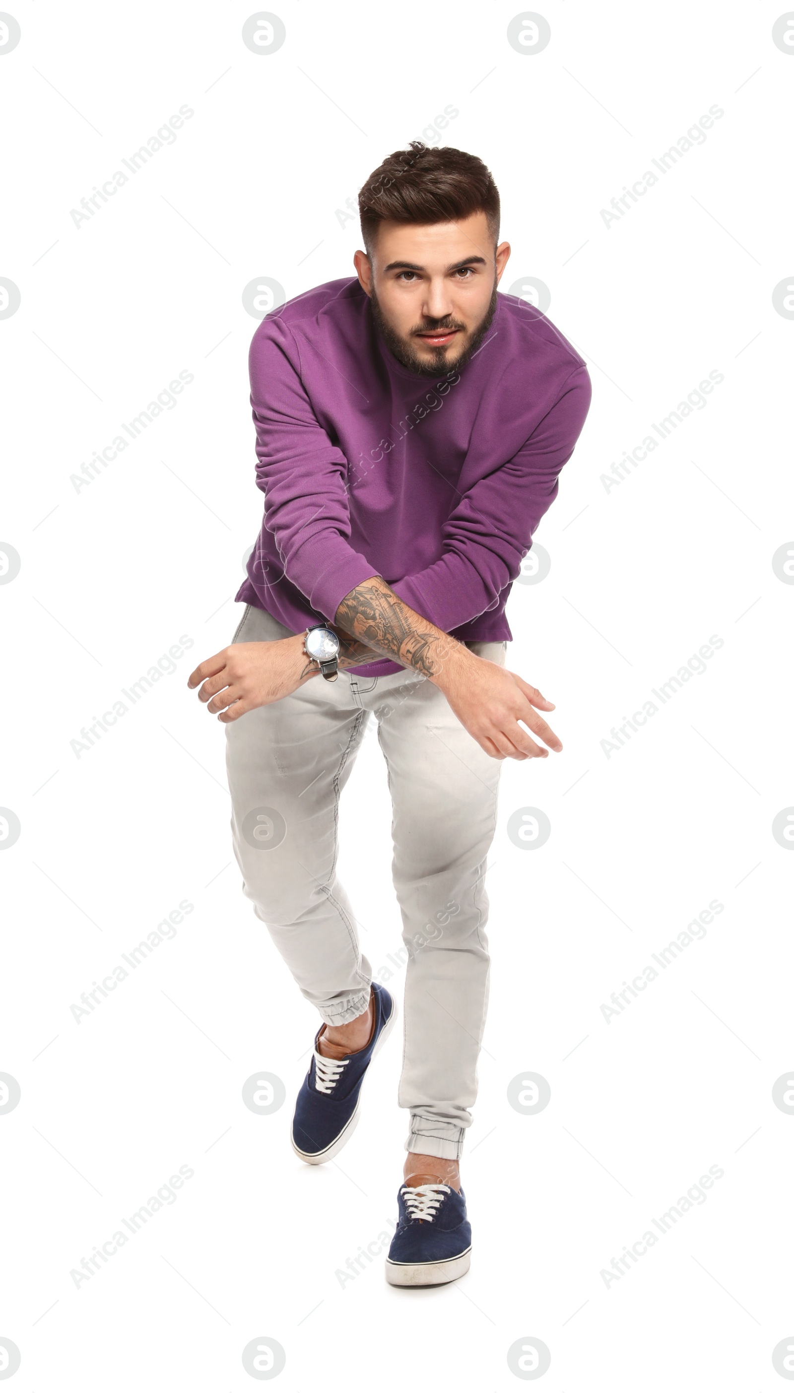 Photo of Handsome young man posing on white background