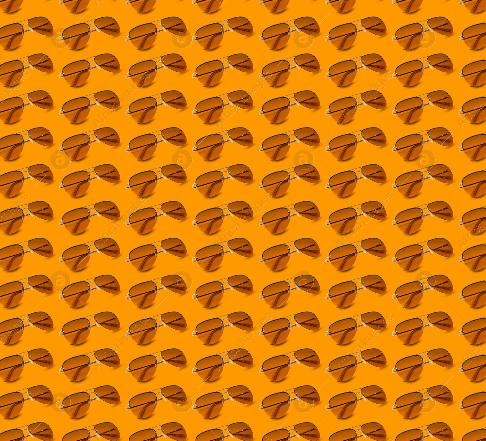 Image of Many stylish sunglasses on orange background. Seamless pattern design