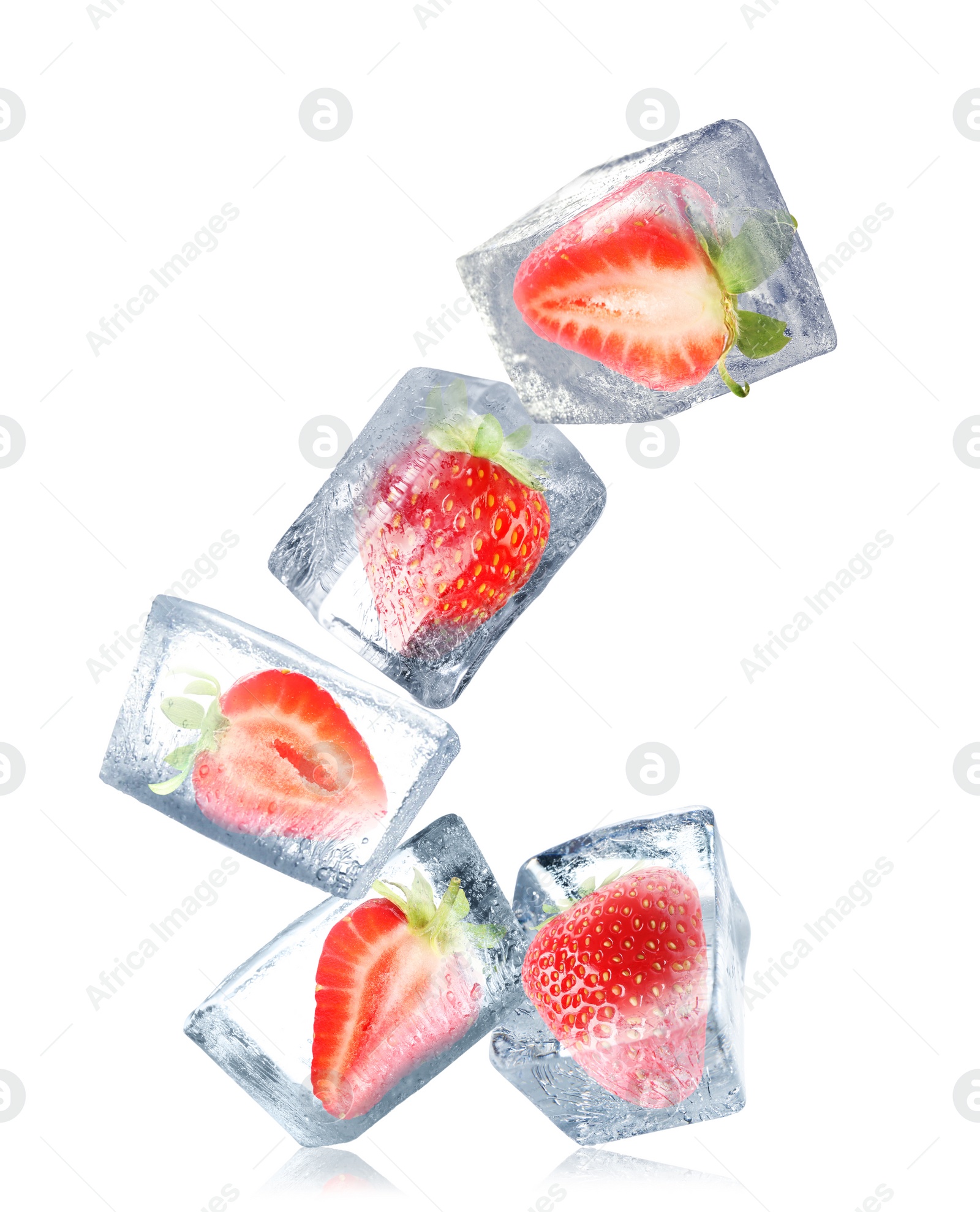 Image of Strawberries frozen in ice cubes falling on white background