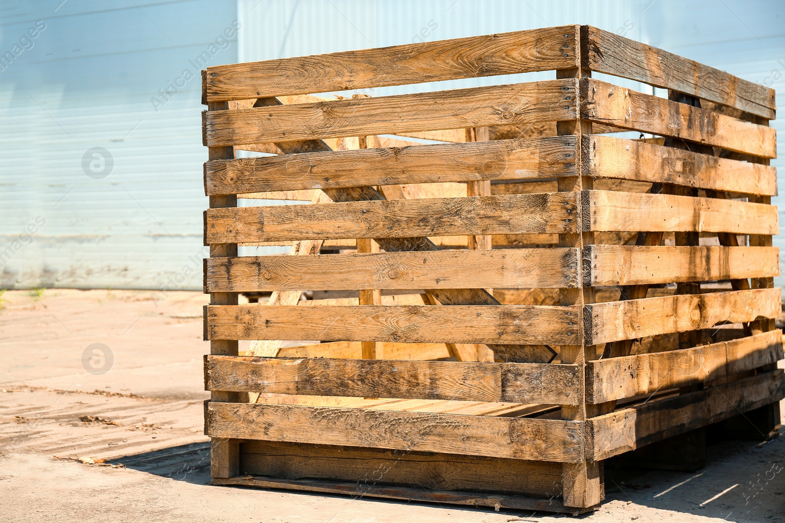 Photo of Old empty wooden crate at warehouse backyard
