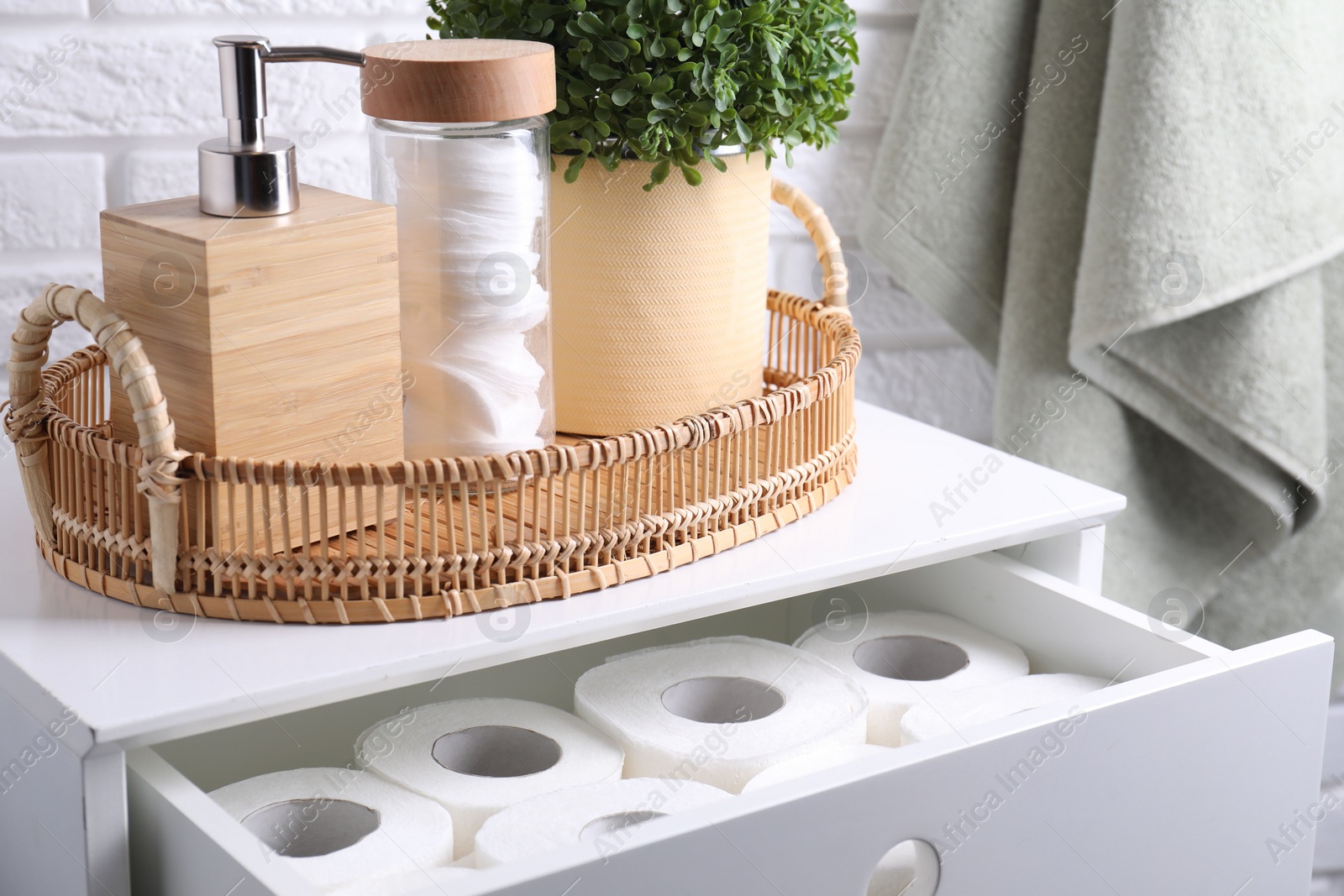 Photo of Many toilet paper rolls in white drawer indoors