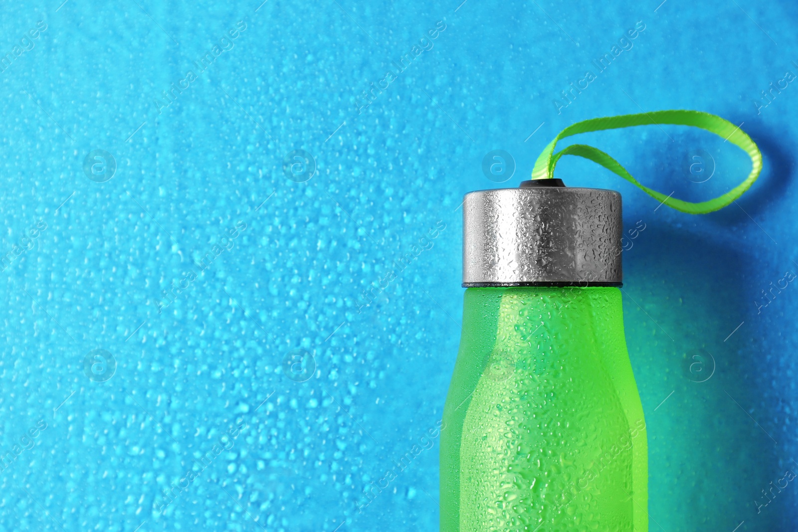 Photo of Sports water bottle on color background. Space for text