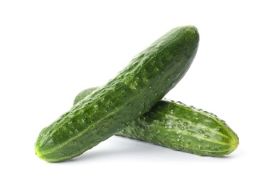 Photo of Fresh green cucumbers on white background