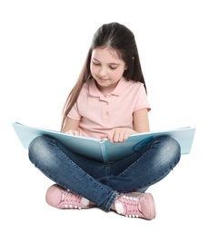 Photo of Cute little girl reading book on white background