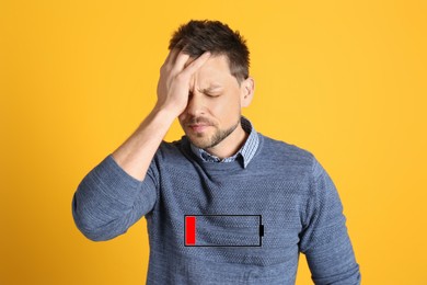 Image of Illustration of discharged battery and tired man on orange background. Extreme fatigue