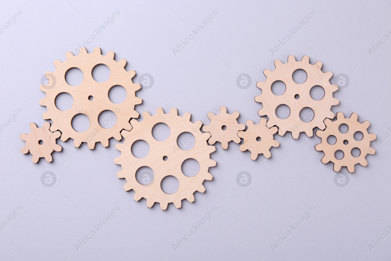 Photo of Business process organization and optimization. Scheme with wooden figures on light background, top view