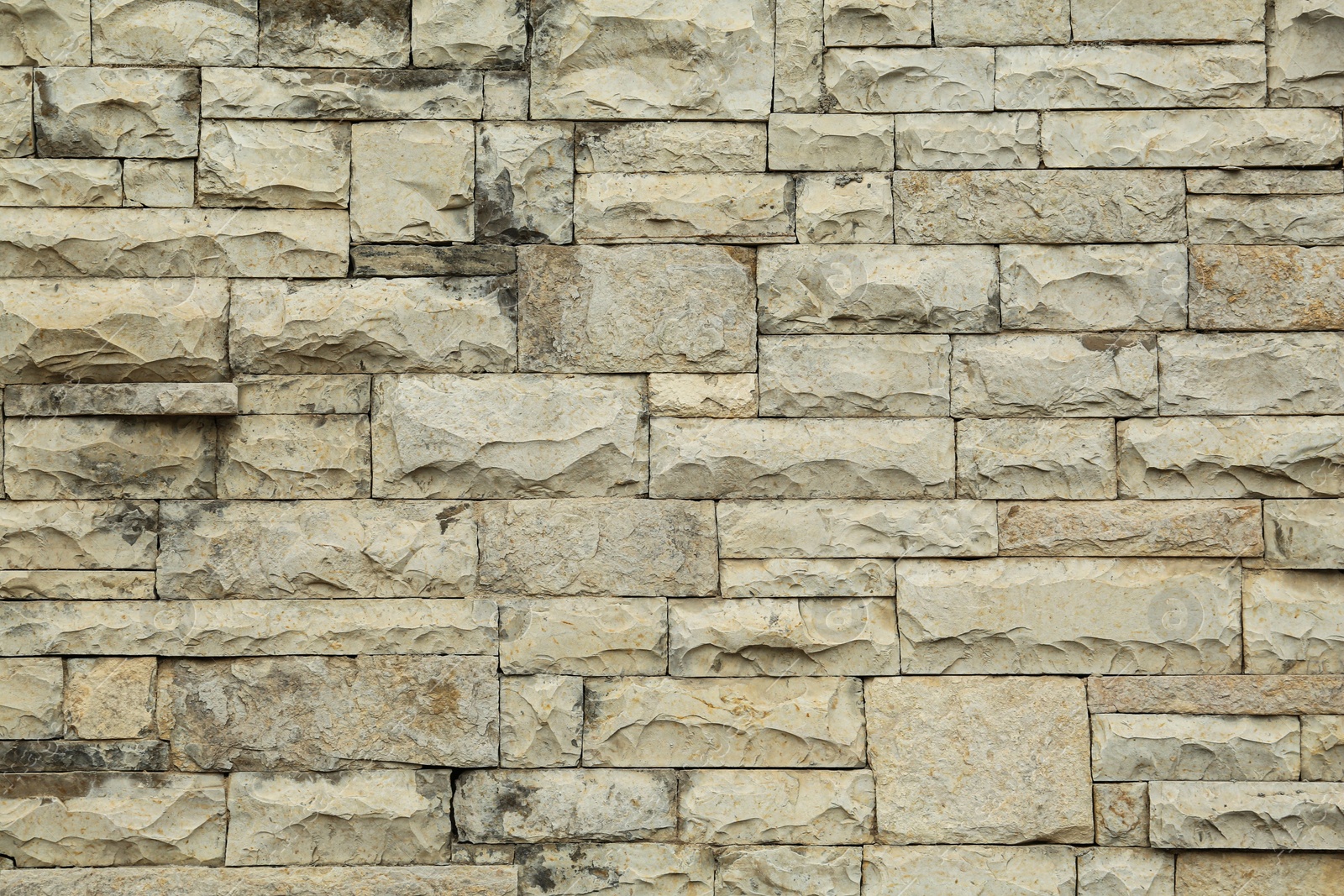 Photo of Texture of stone wall as background, closeup