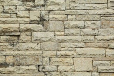 Photo of Texture of stone wall as background, closeup