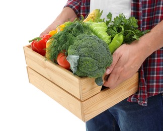 Harvesting season. Farmer holding wooden crate with vegetables on white background, closeup
