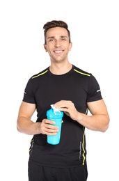 Portrait of man with bottle of protein shake on white background