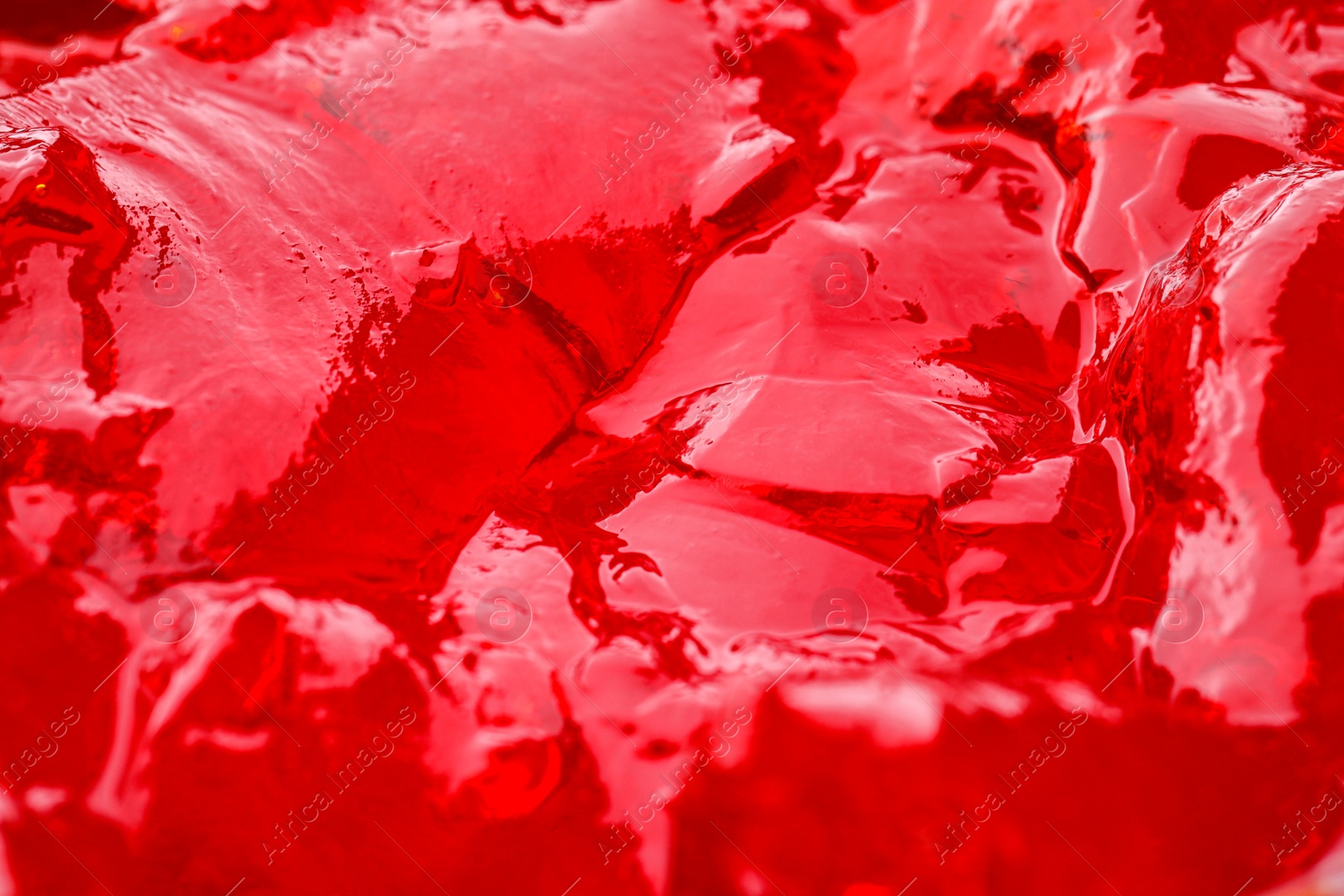 Photo of Delicious red fruit jelly as background, closeup