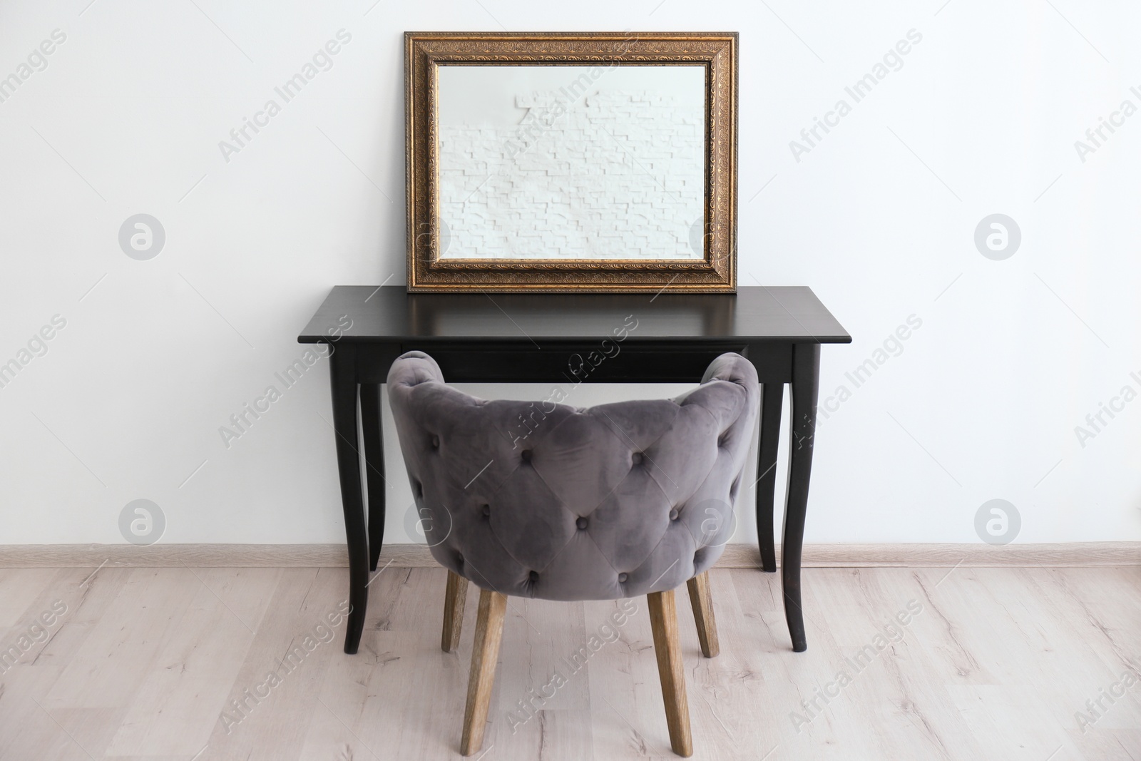 Photo of Modern makeup room interior with dressing table and mirror