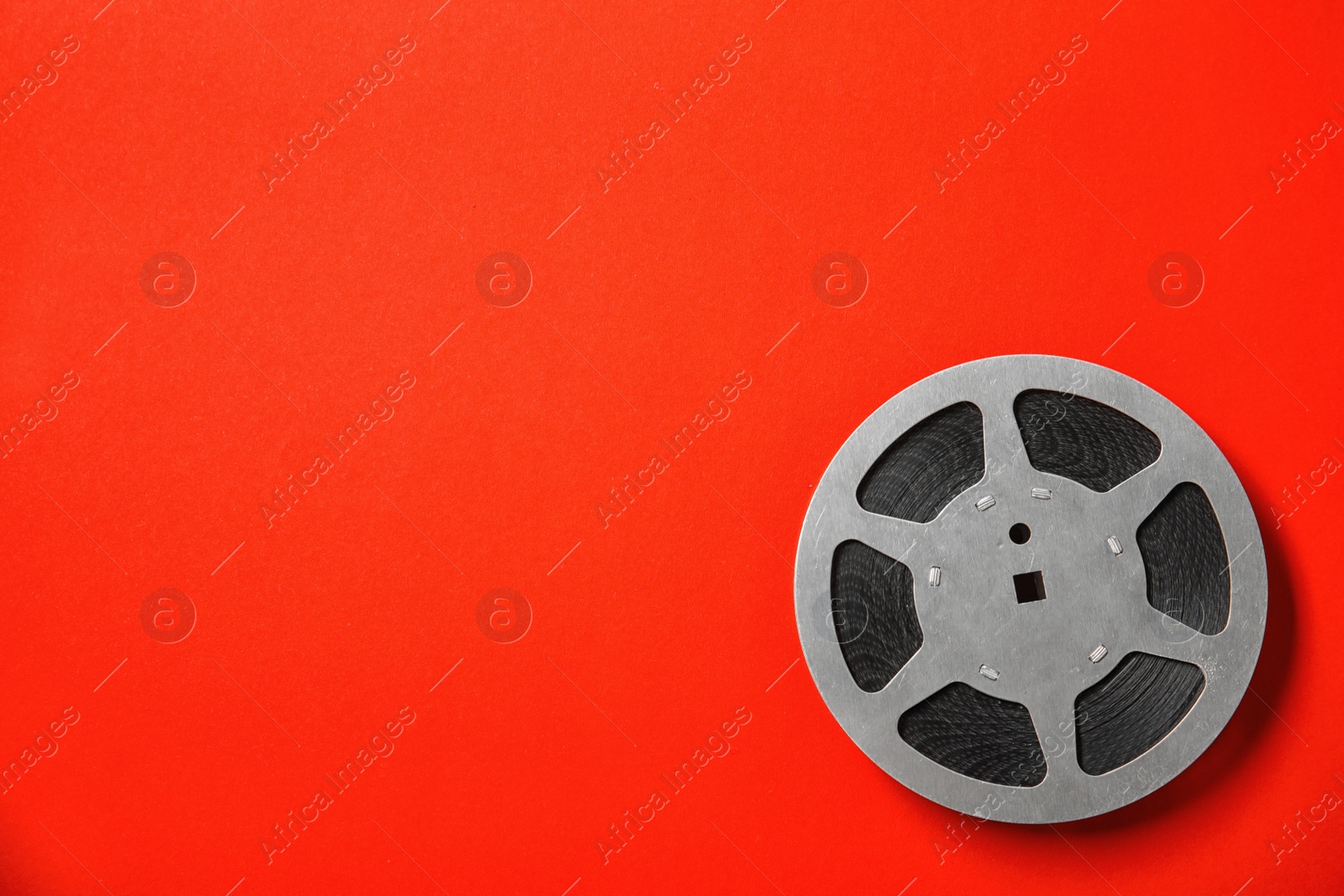 Photo of Movie reel on color background, top view with space for text. Cinema production