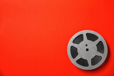 Photo of Movie reel on color background, top view with space for text. Cinema production