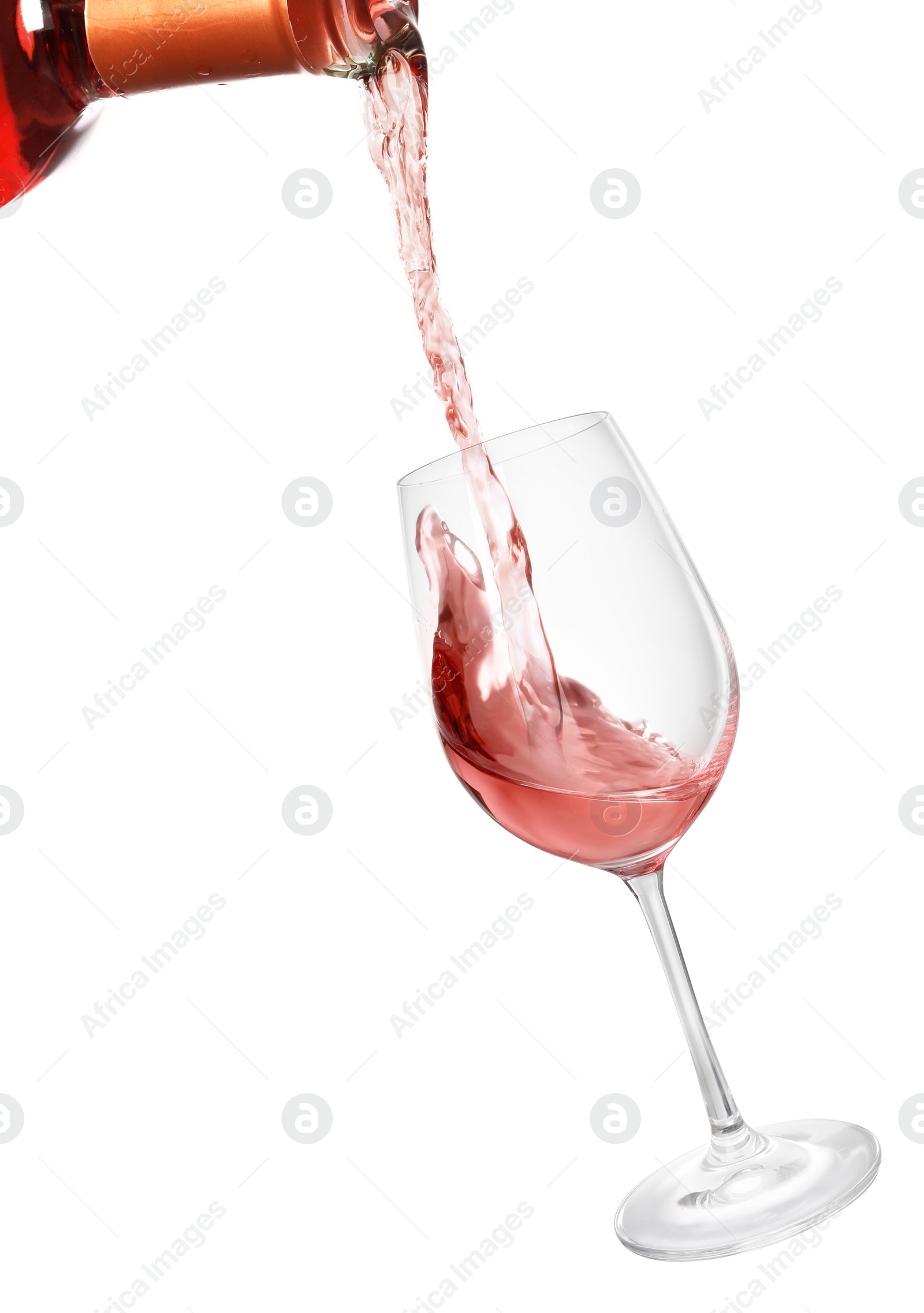 Image of Pouring rose wine from bottle into glass on white background