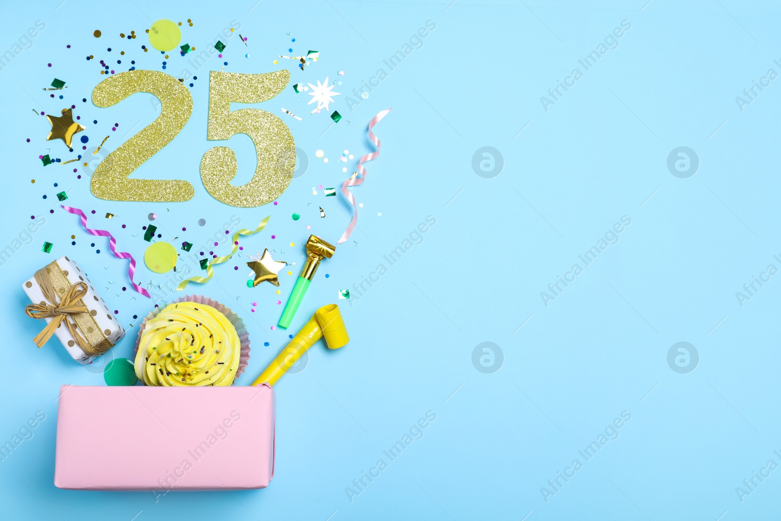 Photo of Flat lay composition with decor and numbers on light blue background, space for text. 25th birthday party