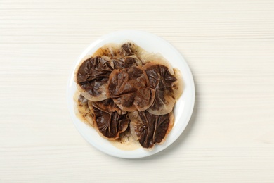 Used tea bags on white wooden table, top view