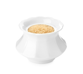 Photo of Ceramic bowl with brown sugar isolated on white