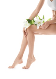 Young woman with beautiful long legs on white background, closeup