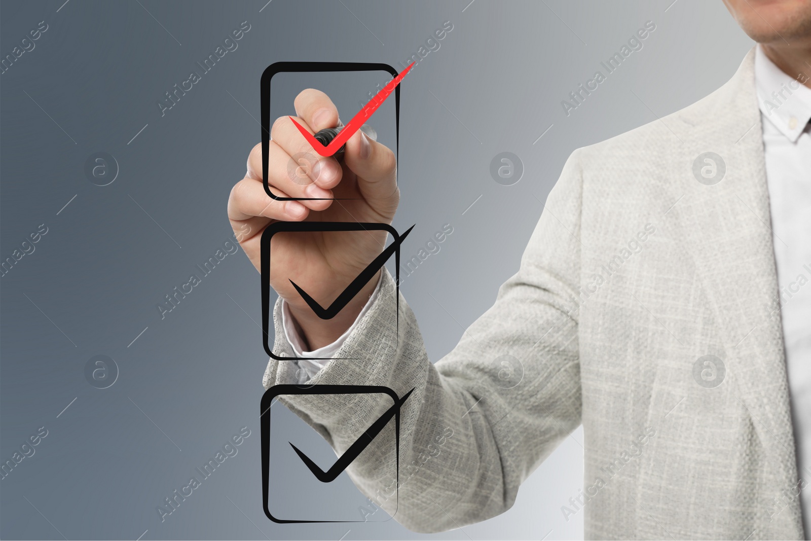 Image of Man pointing at red check mark in box on virtual screen, closeup