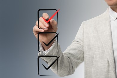 Image of Man pointing at red check mark in box on virtual screen, closeup