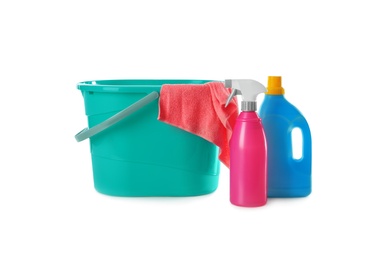 Photo of Plastic bucket with rag and cleaning products on white background