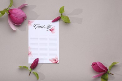 Guest list and beautiful flowers on grey background, flat lay. Space for text