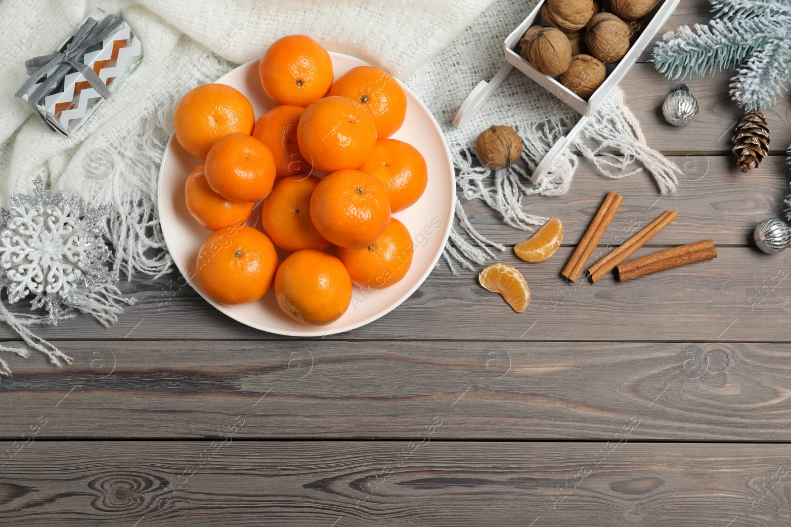 Photo of Flat lay composition with tangerines on wooden background. Space for text