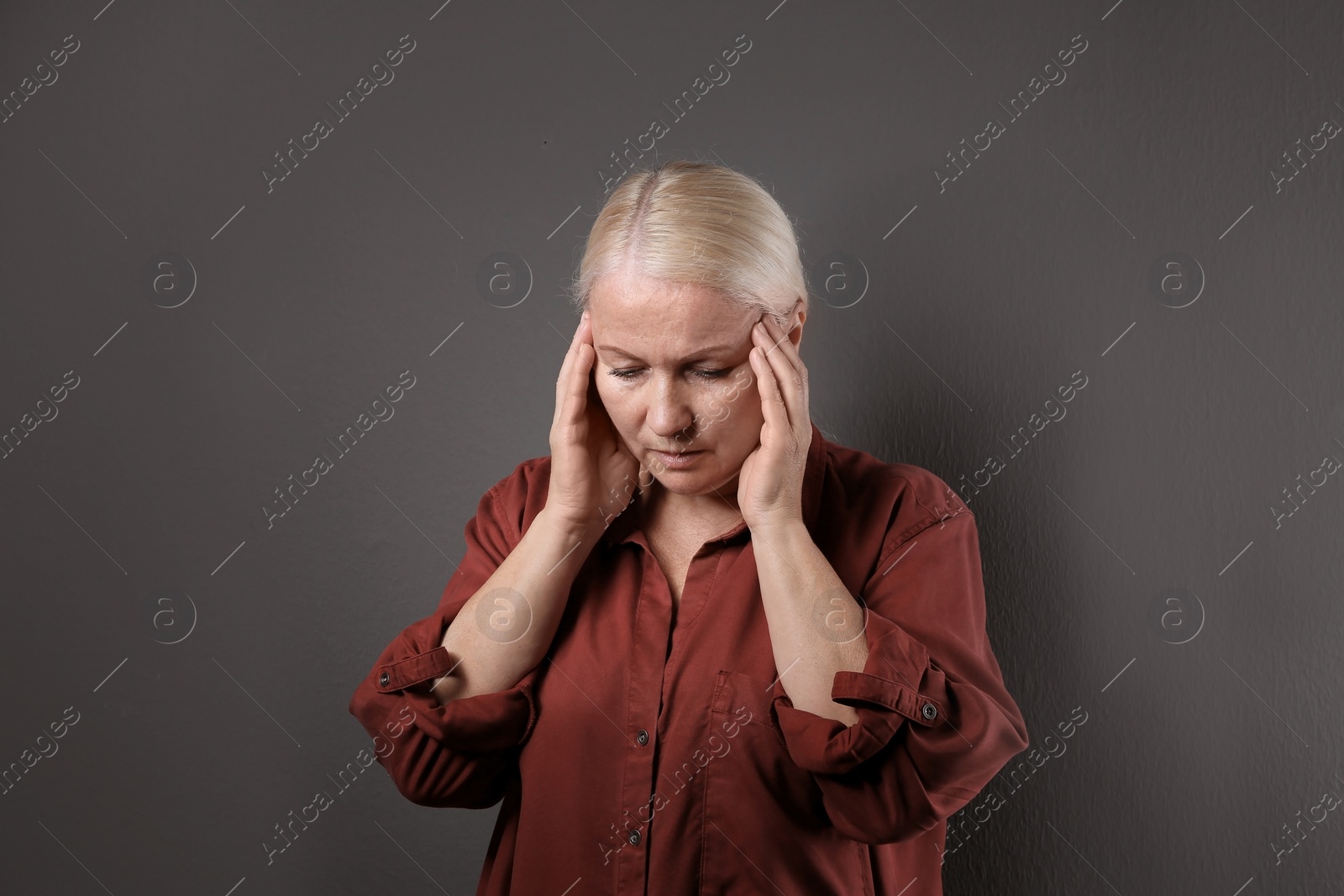 Photo of Mature woman suffering from depression on grey background