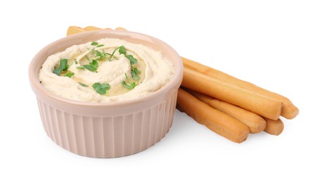 Photo of Delicious hummus with grissini sticks isolated on white