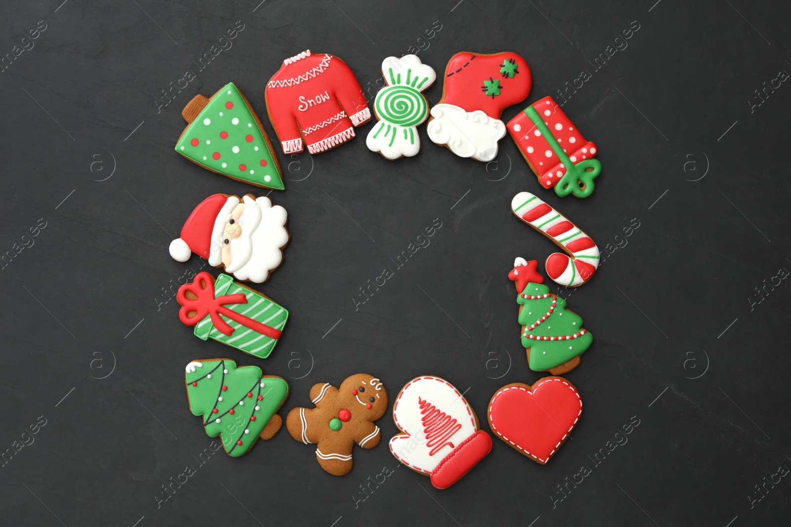 Photo of Frame of delicious Christmas cookies on black table, flat lay. Space for text