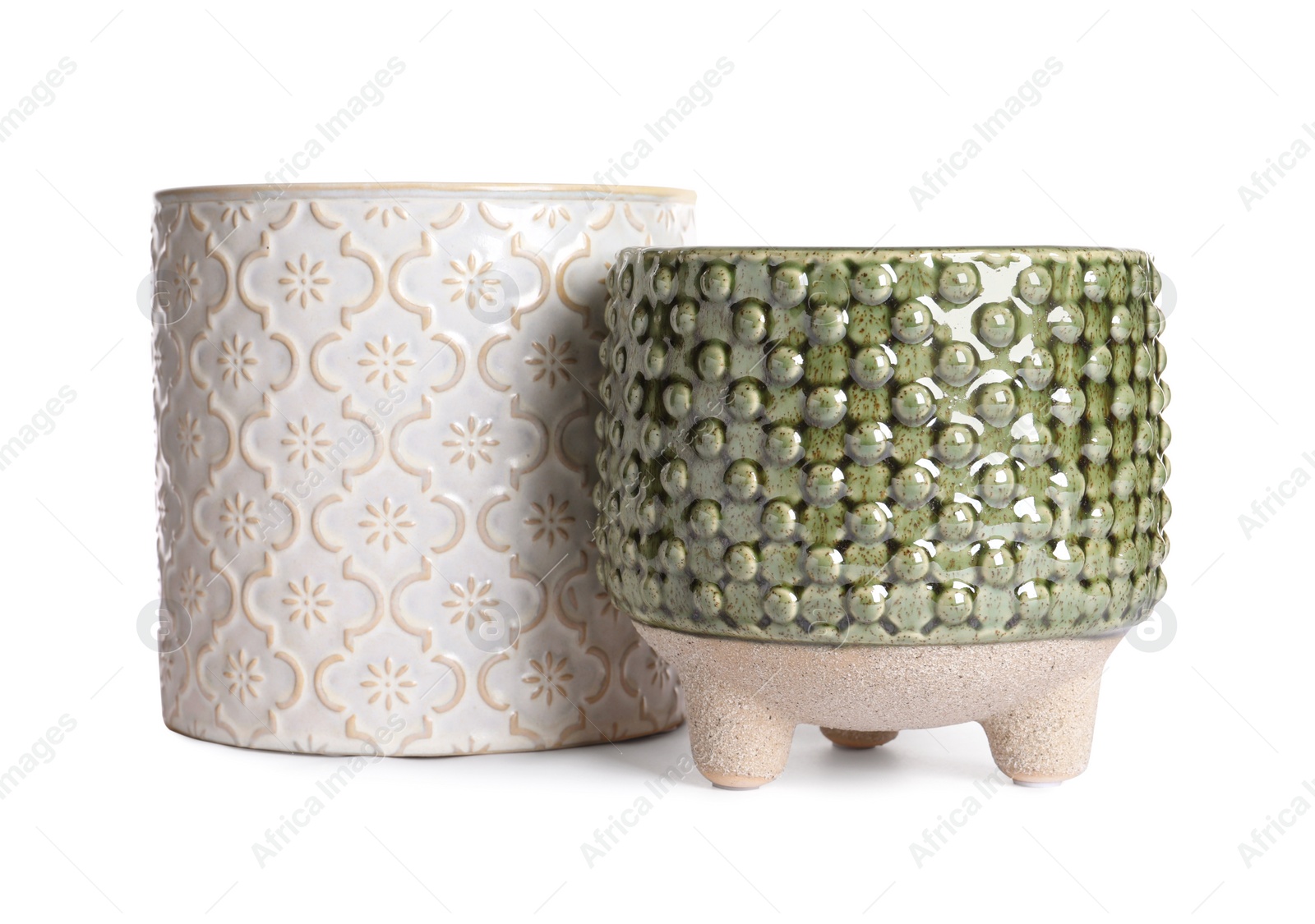 Photo of Different stylish ceramic flowerpots isolated on white