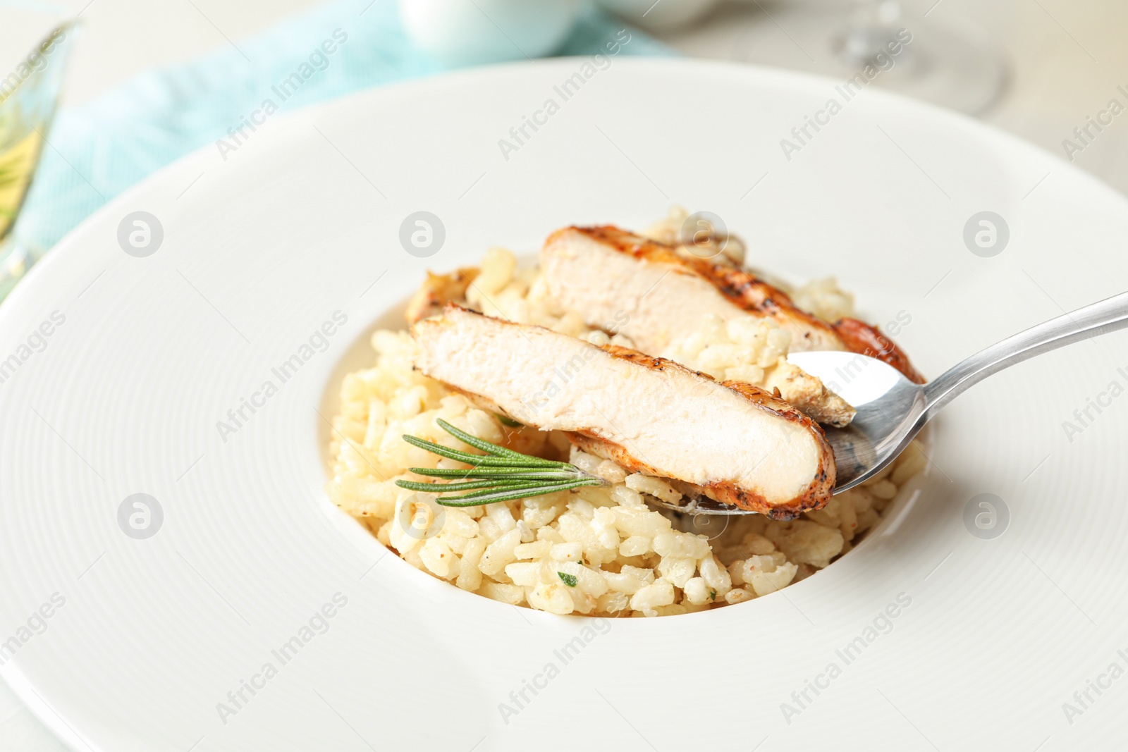 Photo of Delicious fresh chicken risotto in plate, closeup