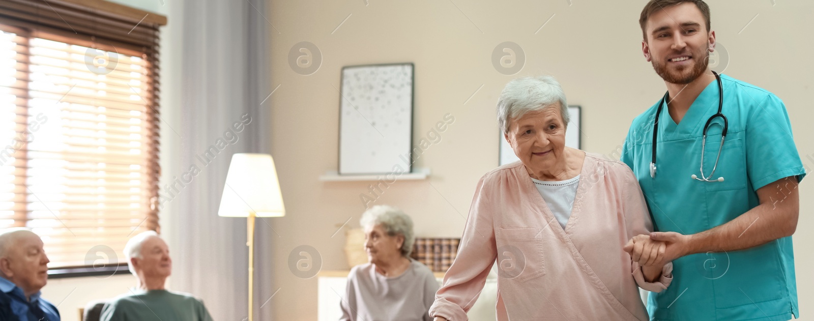 Image of Medical worker taking care of elderly woman in geriatric hospice, space for text. Banner design