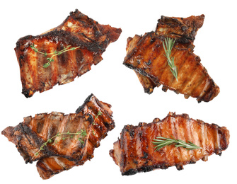 Set of delicious roasted ribs on white background, top view