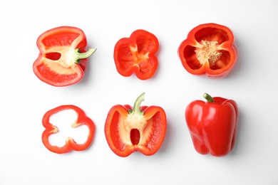 Flat lay composition with raw ripe paprika peppers on white background