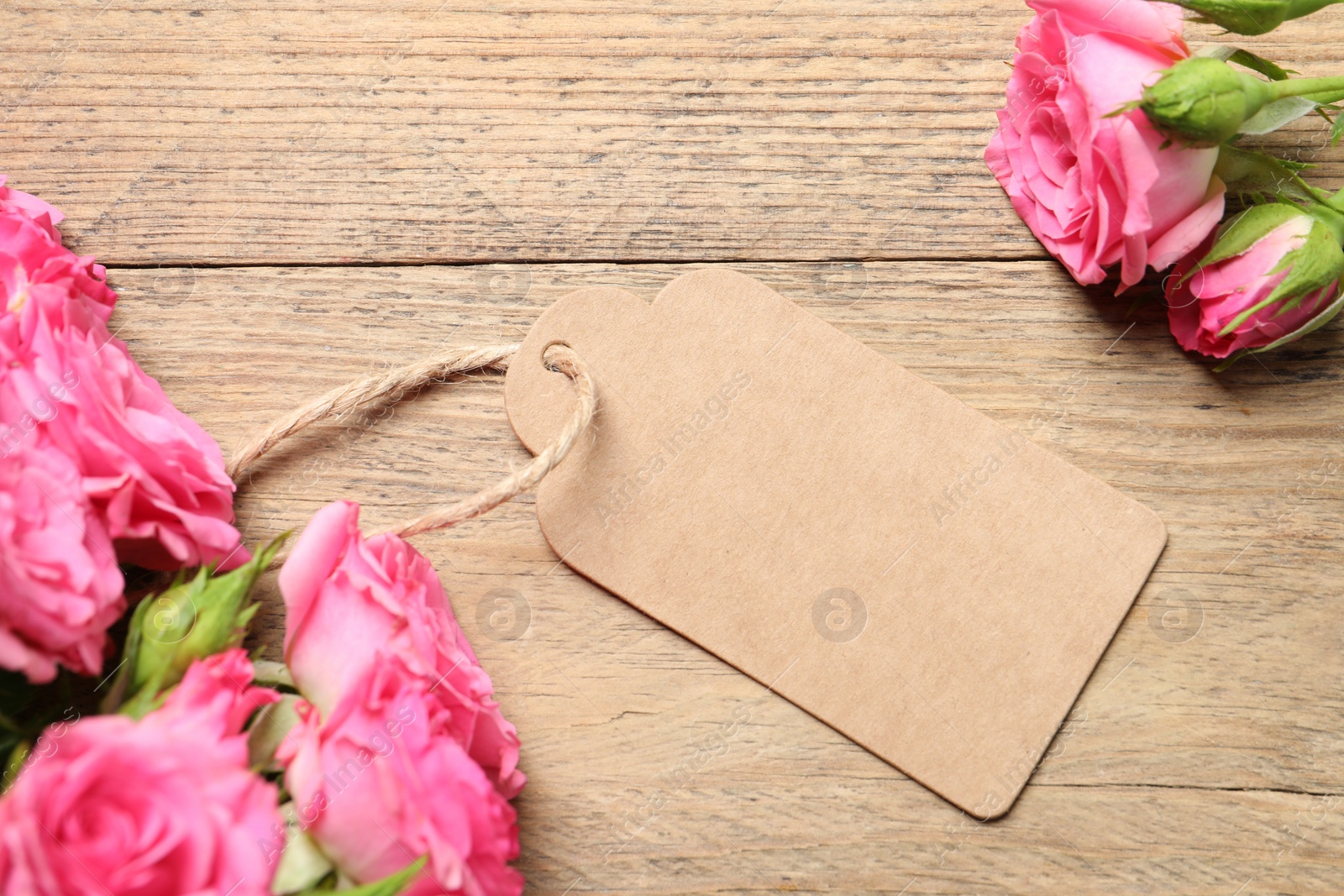 Photo of Happy Mother's Day. Beautiful flowers and blank card on wooden table, flat lay