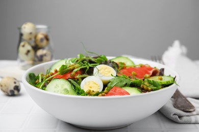 Photo of Bowl of salad with mung beans on white tiled table