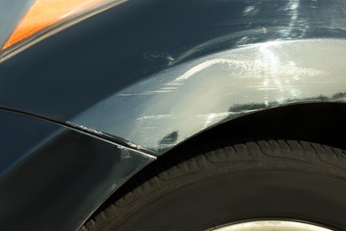 Modern black car with scratch, closeup view