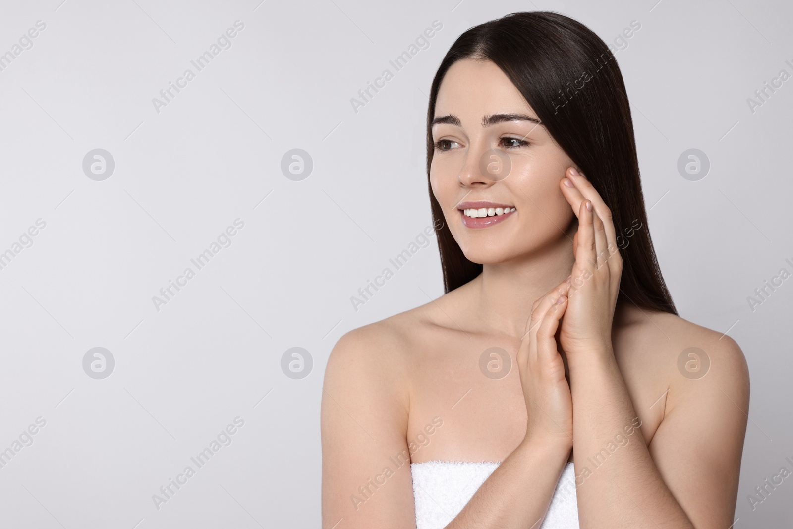 Photo of Portrait of attractive young woman on light grey background, space for text. Spa treatment